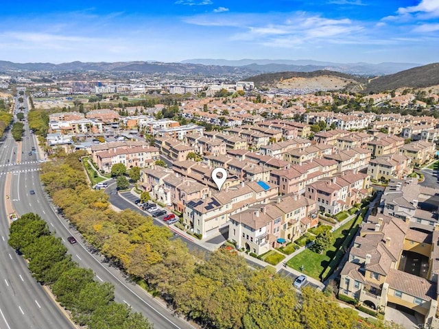 birds eye view of property with a residential view and a mountain view