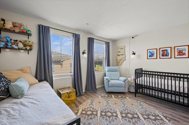 bedroom with wood finished floors