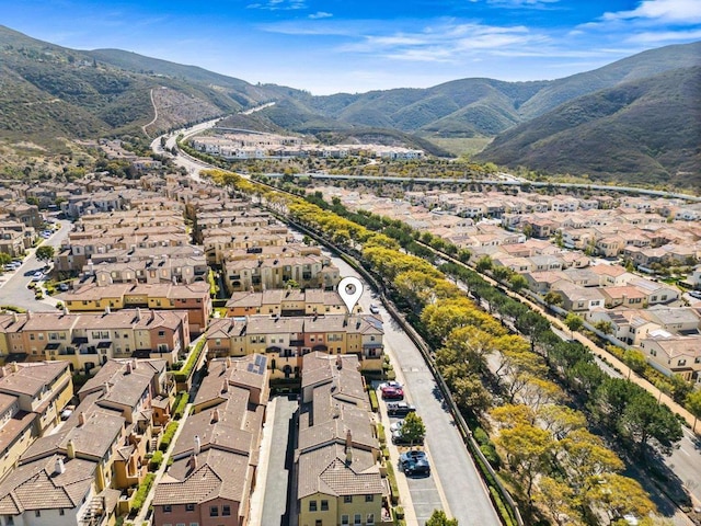 birds eye view of property featuring a mountain view and a residential view