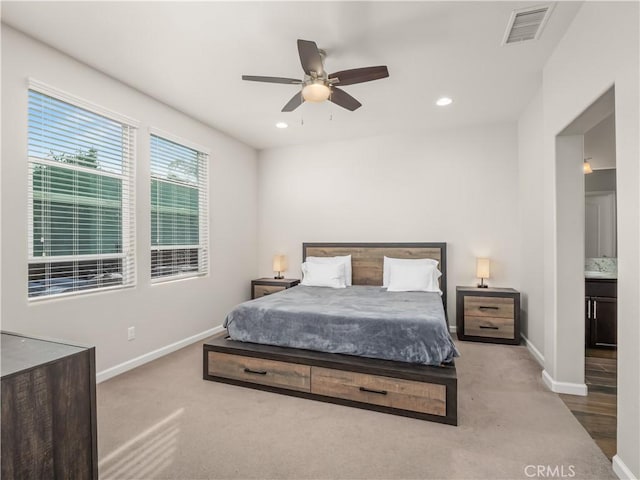 carpeted bedroom with a ceiling fan, recessed lighting, visible vents, and baseboards