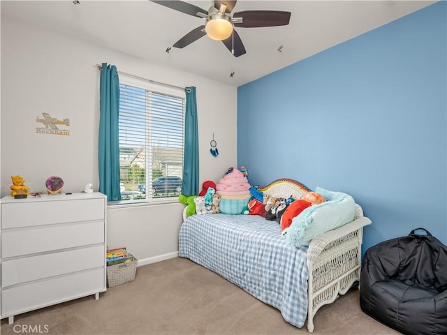 bedroom featuring a ceiling fan, carpet flooring, and baseboards