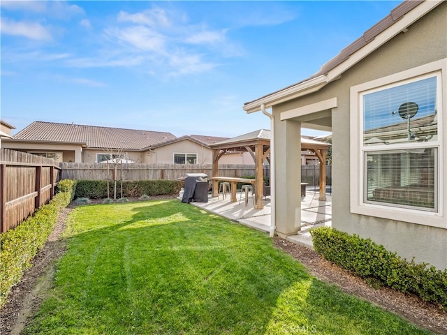 view of yard with a gazebo, a patio area, and a fenced backyard