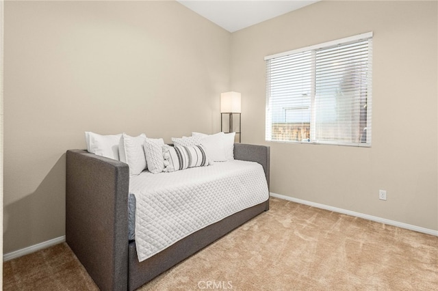 bedroom with carpet and baseboards