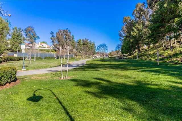 view of home's community featuring a lawn