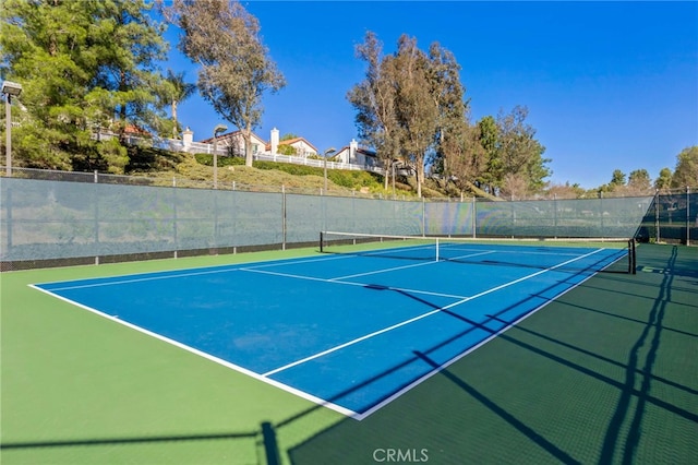 view of sport court with fence