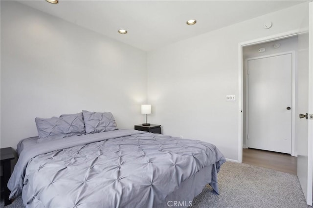 bedroom with baseboards, carpet, and recessed lighting