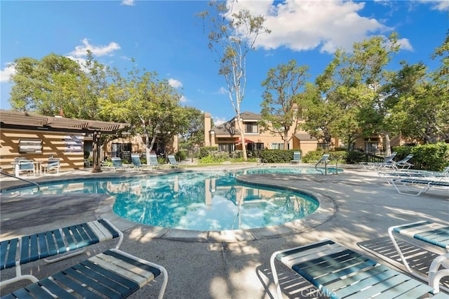 community pool with a patio area