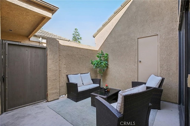 view of patio / terrace with an outdoor hangout area and fence