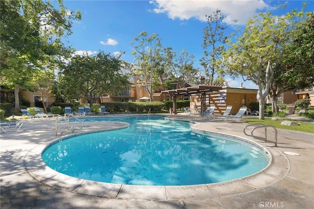 pool featuring a patio and a pergola