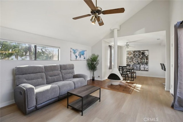 living room featuring ceiling fan, high vaulted ceiling, wood finished floors, and baseboards