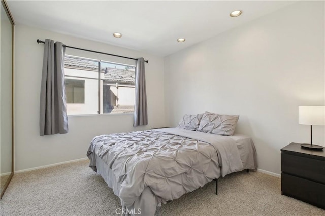 carpeted bedroom with recessed lighting and baseboards