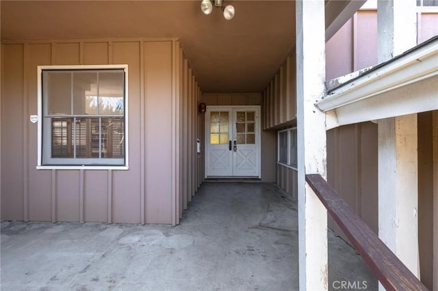 entrance to property featuring board and batten siding