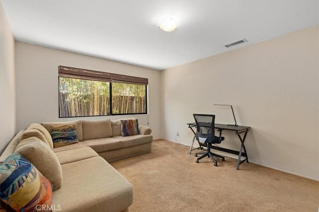 living area featuring carpet flooring and visible vents