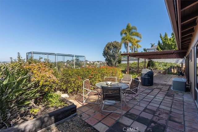 view of patio with outdoor dining space and a pergola