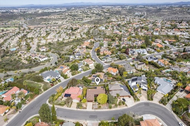 birds eye view of property with a residential view