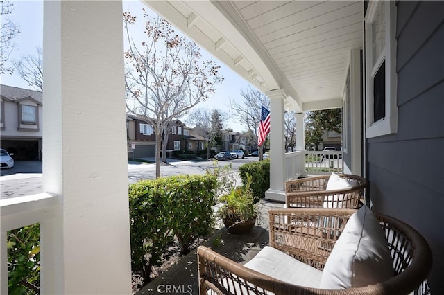 balcony with a residential view and covered porch