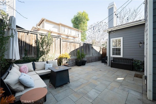 view of patio / terrace with outdoor lounge area and a fenced backyard
