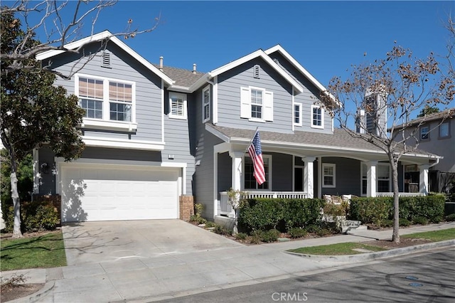 view of front of property with a porch, an attached garage, a shingled roof, driveway, and a chimney