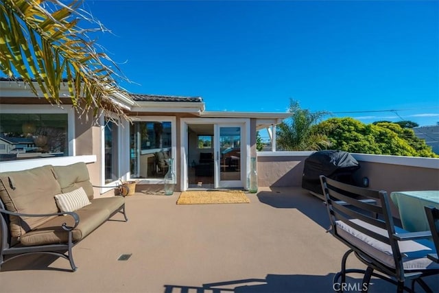 view of patio featuring a grill