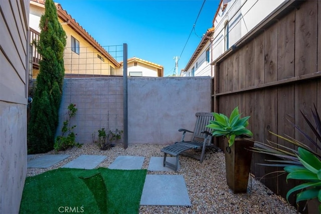 view of yard featuring a patio area and a fenced backyard