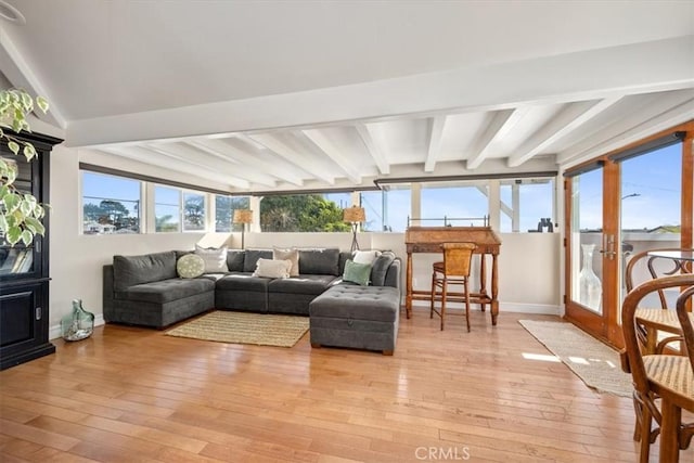 sunroom featuring beamed ceiling