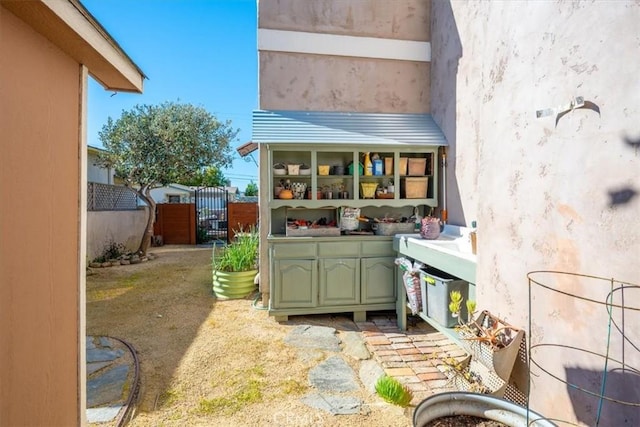 back of house featuring fence