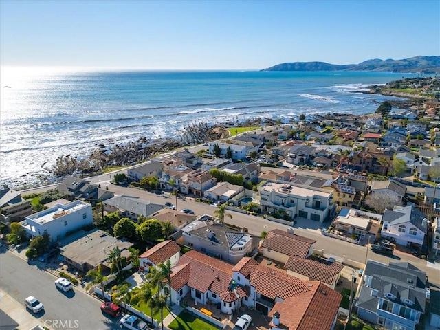 drone / aerial view featuring a water view and a residential view