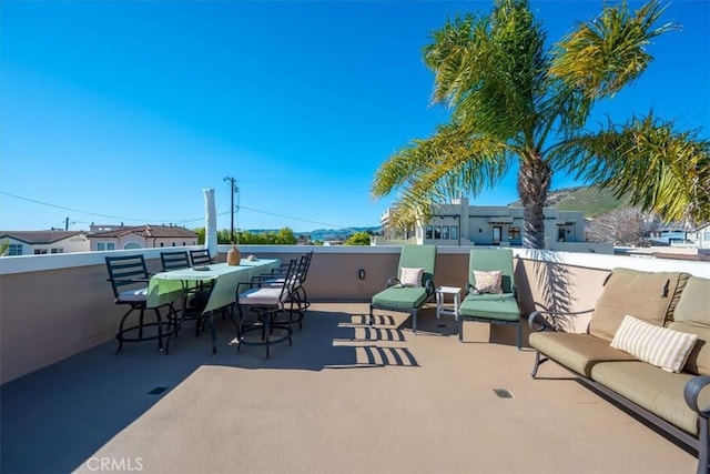 view of patio with outdoor dining space and an outdoor living space