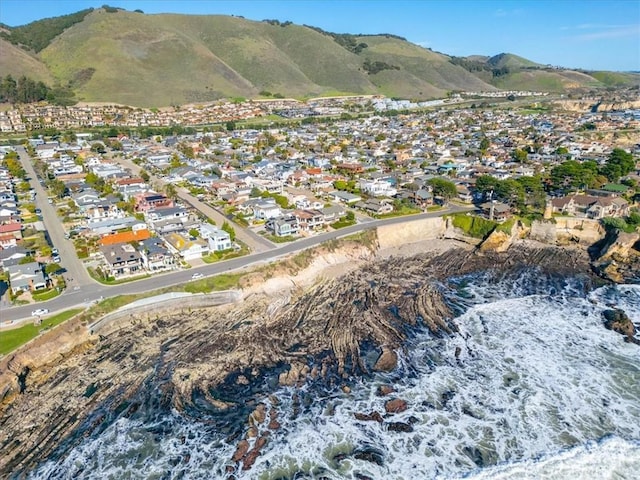 drone / aerial view with a residential view and a mountain view