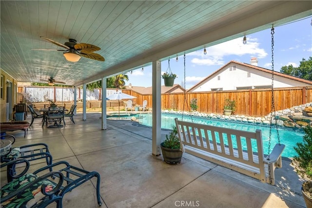 19390 Okeechobee Ln, Lake Elsinore, CA 92530 - fenced backyard with ceiling fan, a patio area, and outdoor dining space