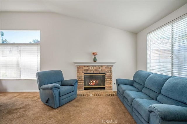 19390 Okeechobee Ln, Lake Elsinore, CA 92530 - carpeted living room with vaulted ceiling, a brick fireplace, and baseboards