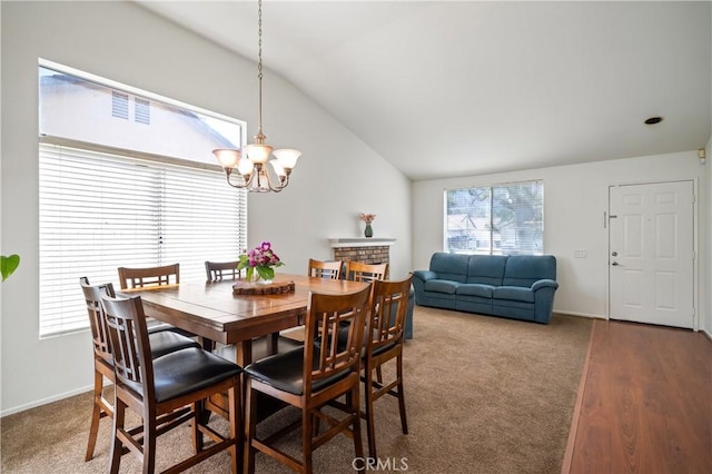 19390 Okeechobee Ln, Lake Elsinore, CA 92530 - carpeted dining room with vaulted ceiling, a chandelier, and baseboards