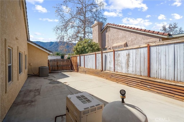 19390 Okeechobee Ln, Lake Elsinore, CA 92530 - view of patio / terrace with a mountain view and cooling unit