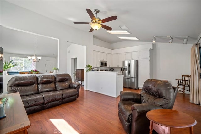 19390 Okeechobee Ln, Lake Elsinore, CA 92530 - living room featuring ceiling fan, a chandelier, lofted ceiling, wood finished floors, and track lighting