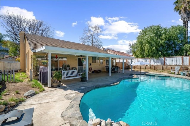 19390 Okeechobee Ln, Lake Elsinore, CA 92530 - view of swimming pool featuring a patio area, a fenced backyard, and ceiling fan