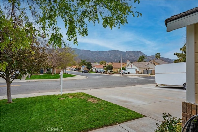 19390 Okeechobee Ln, Lake Elsinore, CA 92530 - view of green lawn with a residential view and a mountain view