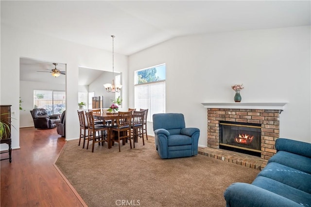 19390 Okeechobee Ln, Lake Elsinore, CA 92530 - living area with lofted ceiling, wood finished floors, a brick fireplace, a chandelier, and a ceiling fan