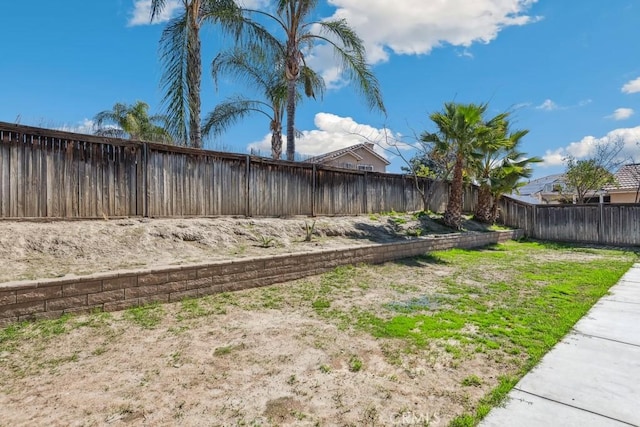 view of yard with a fenced backyard