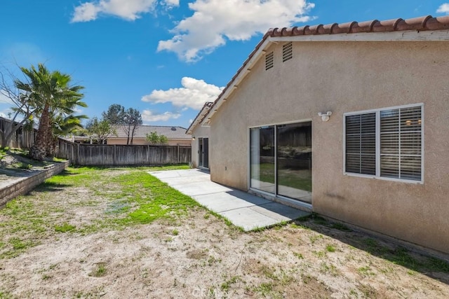 view of yard with a patio and fence