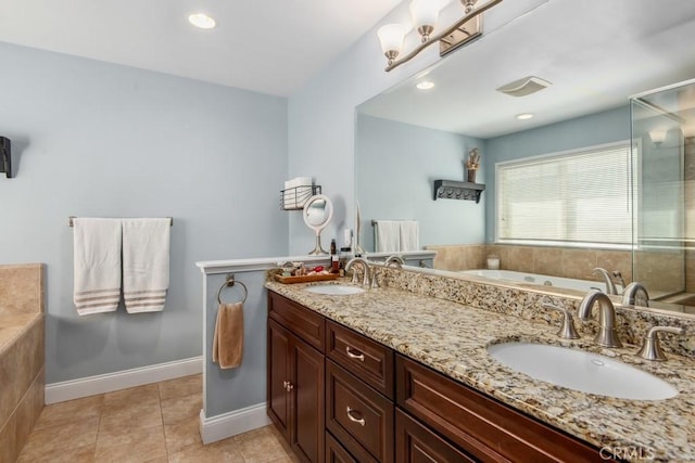 bathroom featuring a sink, a shower stall, a bath, and tile patterned floors