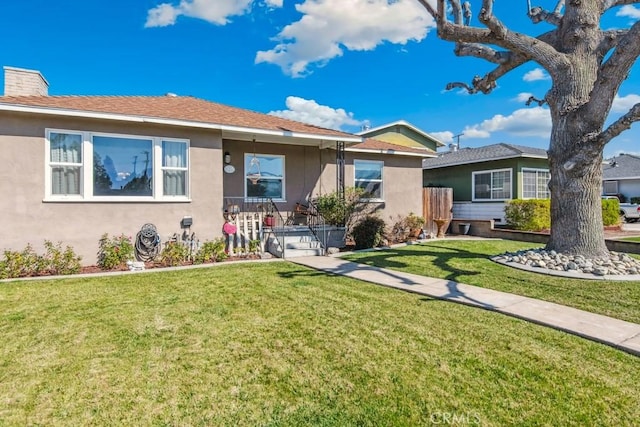 single story home featuring a front yard, a chimney, and stucco siding