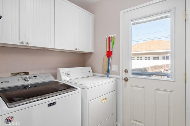 laundry room featuring cabinet space and washer and clothes dryer