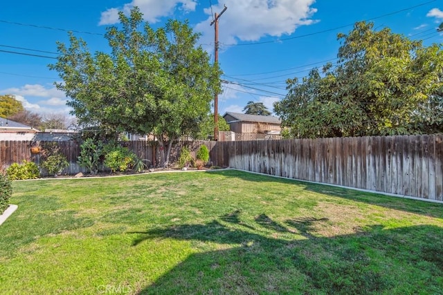 view of yard featuring a fenced backyard