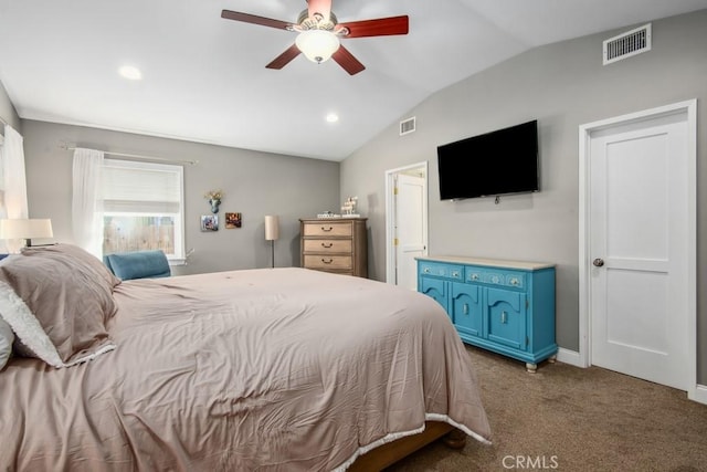 bedroom featuring lofted ceiling, ceiling fan, carpet flooring, visible vents, and baseboards