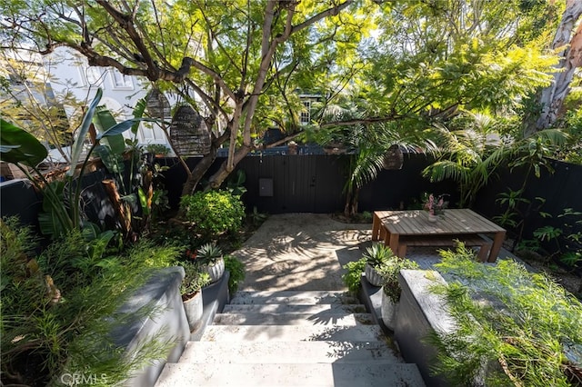 exterior space with a patio area and a fenced backyard