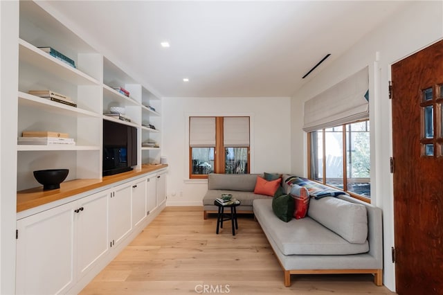 living area with light wood-style floors