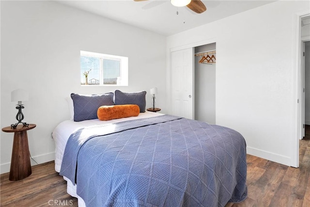 bedroom with a ceiling fan, a closet, baseboards, and wood finished floors