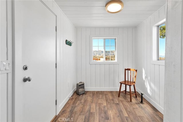 living area with wood finished floors and baseboards