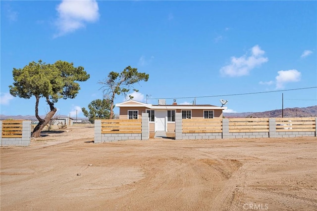 manufactured / mobile home featuring fence and a mountain view