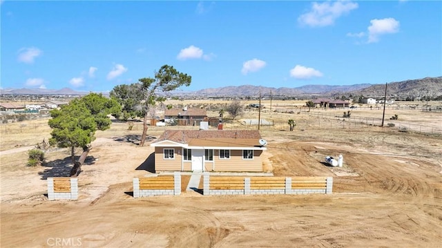 birds eye view of property with a mountain view